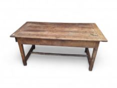 A 19th-century stained-oak dining table