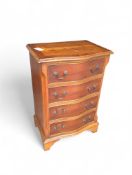 A reproduction bow-fronted chest of drawers