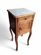 A French oak bedside cabinet