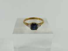 An 18ct gold sapphire and diamond three stone ring