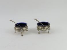 A pair of Victorian silver salt pots each with a p