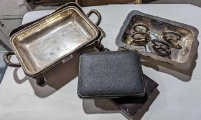 Two cases of silver flatware alongside a selection