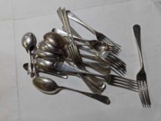 A large collection of silver flatware, comprising