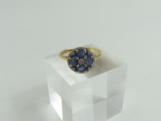 A 14ct gold sapphire and diamond cluster type ring
