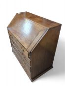 A 20th-century oak bureau
