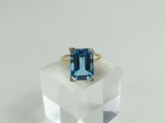 A 9ct gold blue topaz cocktail ring, the rectangul
