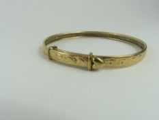 An unmarked gold expanding bangle, decorated with