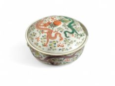 A Chinese circular container and cover painted wit