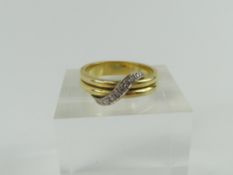 An 18ct yellow and white gold diamond set dress ri