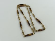 A 9ct gold tigers eye necklace, the rondels of tig