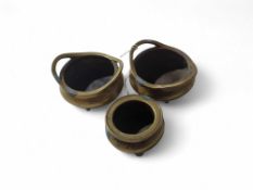 A pair of bronze censers, of usual form and each o