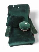 An American green velvet armchair with cushion, foot stool a