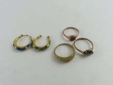 A 9ct rose gold ring set with a pale purple stone,