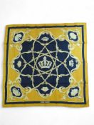 Hermes - a scarf decorated in black and gold with crown mo