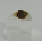 A 9ct gold signet ring, with a plain square head,