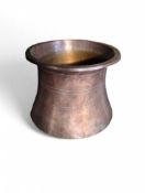 A Turkish copper pot in the shape of a curved chimney. 25c