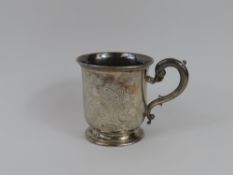 A Victorian, silver and handled cup with floral sw