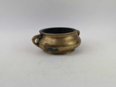 A large bronze censer, of plain form, with two han