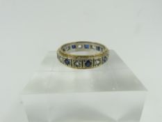 A blue and white stone full eternity ring, finger