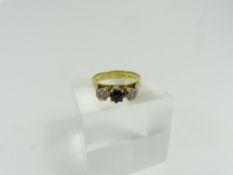 An 18ct gold sapphire and diamond three stone ring