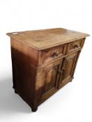 A 20th-century small pine dresser base