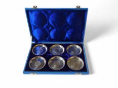 A cased set of six white metal dishes, each dish w