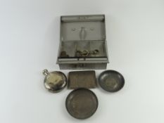 A silver art deco cigarette case, two white metal