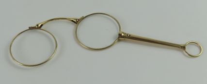 A pair of lorgnettes, of usual design, the handle