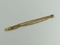 A three colour gold bracelet, the three strands of
