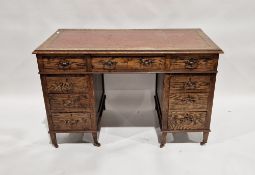 Early 20th century oak twin-pedestal desk with gilt tooled leather insert to top, central long