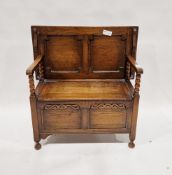 Oak monk's bench with carved frieze to the front panel, on turned feet, 72cm high x 92cm wide x 49cm