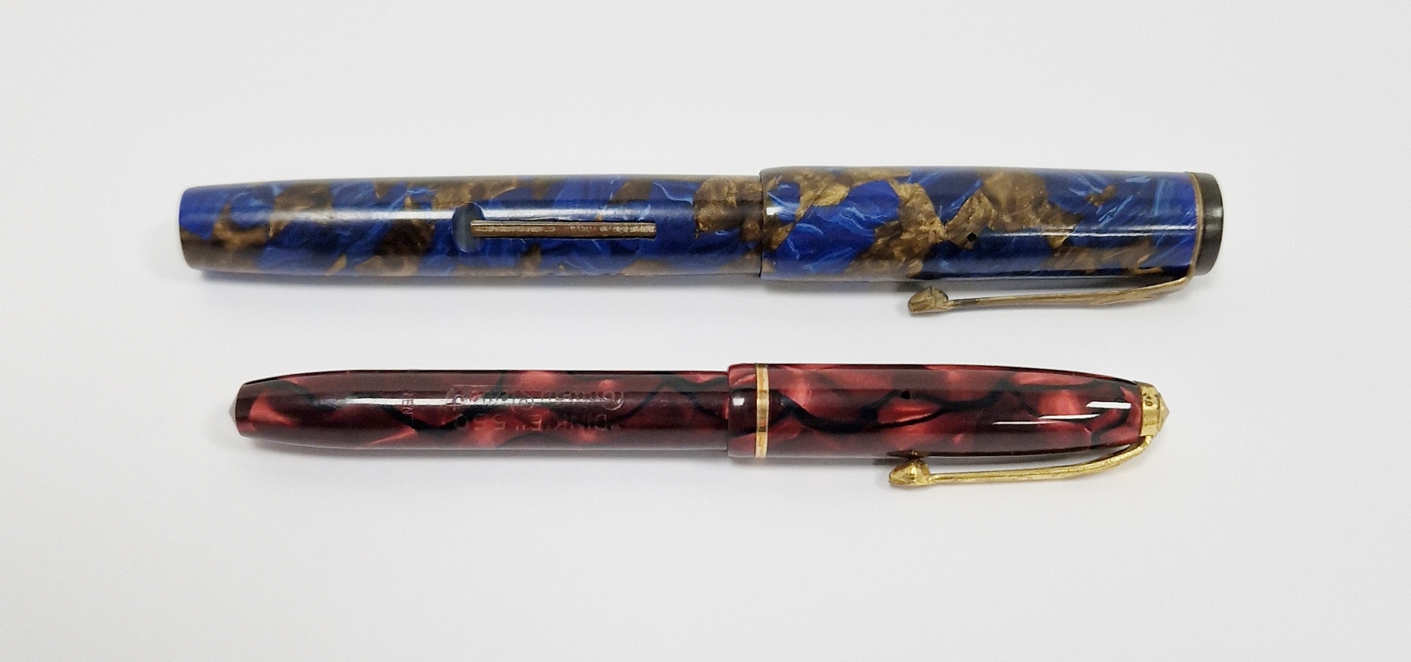 Vintage Conway Stewart fountain pen with marbled case, stamped no.240 in a blue and gold marbled