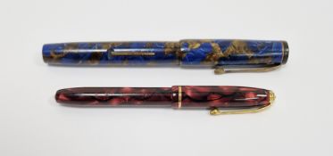 Vintage Conway Stewart fountain pen with marbled case, stamped no.240 in a blue and gold marbled