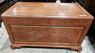 20th century carved camphorwood travelling trunk/blanket box having carved bamboo motifs to front,