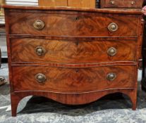 Georgian mahogany serpentine chest of drawers having three long drawers of graduating form, raised