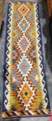 Chobi kilim runner with five-lozenge totem and hooked borders, 213cm x 61cm