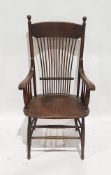 Late 19th century elm seated elbow chair, with spindle back, turned knopped supports and scroll