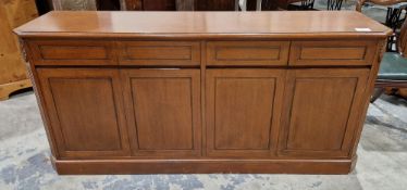 Modern stained wooden sideboard comprising four short drawers, raised over two two-door cupboards,