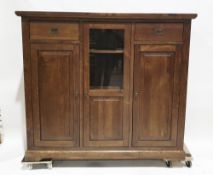 Modern stained veneered cabinet comprising a central partially glazed cupboard with two adjustable