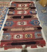 19th century Anatolian kilim, woven with bands of hexagonal guls in blue, black, cream and red on