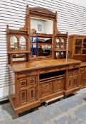 Large 19th century figured oak sideboard with unusually large mirrored top section, raised over