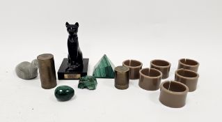 Set of retro brown plastic napkin rings, a carved Canadian Eskimo art soapstone model of a bird, a