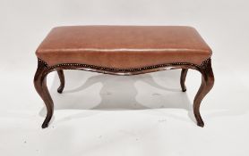 Mahogany duet piano stool with leather upholstered seat having riveted border, raised on cabriole