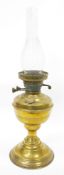 Victorian brass-mounted oil lamp, with pierced burner, marked 'British Made' above clear chimney
