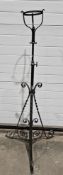 Antique iron telescopic standard lamp stand on curved tripod base, 121cm high at its shortest