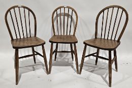 Set of three wheelback dining chairs with spindle backs, raised on turned legs, 90cm high (3)
