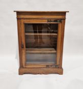 Late 19th/early 20th century oak pier cabinet with Art Nouveau hammered copper finish door bracket