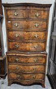 Georgian-style walnut serpentine tallboy, the chest-on-chest with two short drawers above three long
