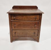 Early to mid 20th century oak chest of three long drawers, each with turned handles