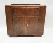 Mid century oak side cabinet with a single long drawer over two single door cupboards with chrome